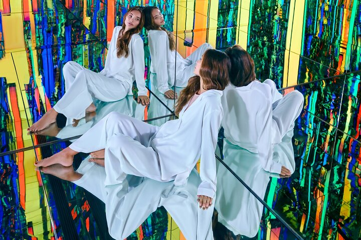 Step into a striking world of art and technology where mirrors and colorful designs create a unique backdrop for unforgettable moments and creative exploration in Dubai.